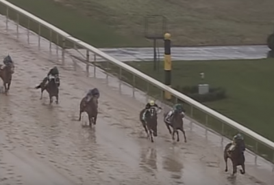 American Pharoah wins a "sloppy" edition of the Rebel Stakes in 2015.