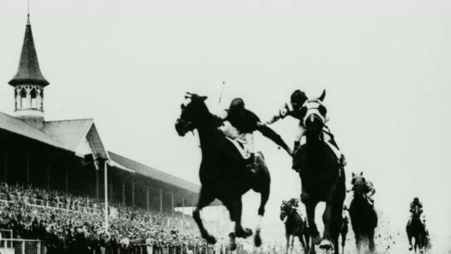 Jockeys Don Meade (right) and Herb Fisher (left) grabbed and pushed each other down the stretch of the 1933 Kentucky Derby in what was aptly called the "Fighting Finish."