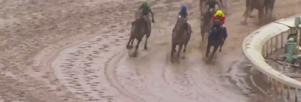 Exaggerator launches his bid on the outside in the Santa Anita Derby and powers to victory.