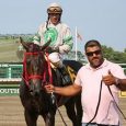 Jorge Navarro leads a horse into the winner's circle at Monmouth Park - Phote courtsy of Bill Denver - Equi-Photo/ BloodHorse
